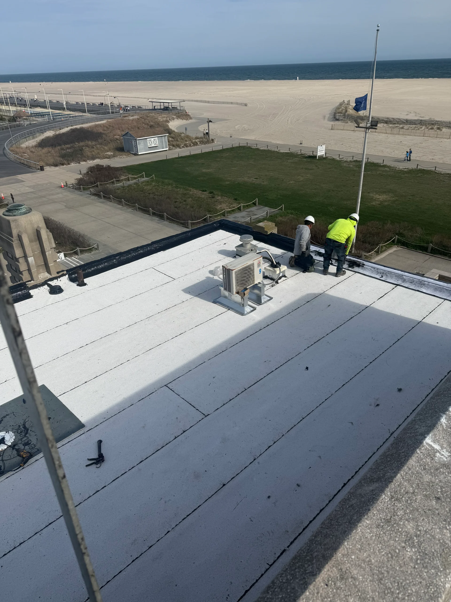 Workers with beachfront view at The Gatsby